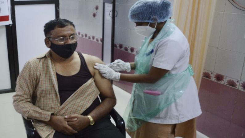 Man taking a vaccination jab