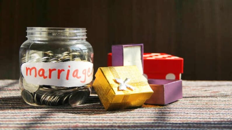 Coins in money jar with marriage label, finance concep