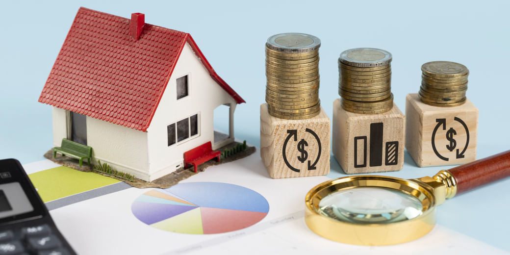 What is assured return scheme in real estate?